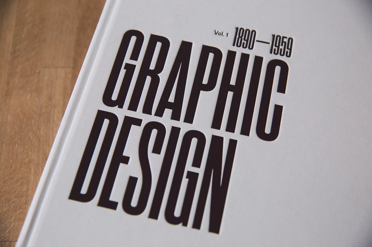 Services Close-up image of a graphic design book cover with bold text.